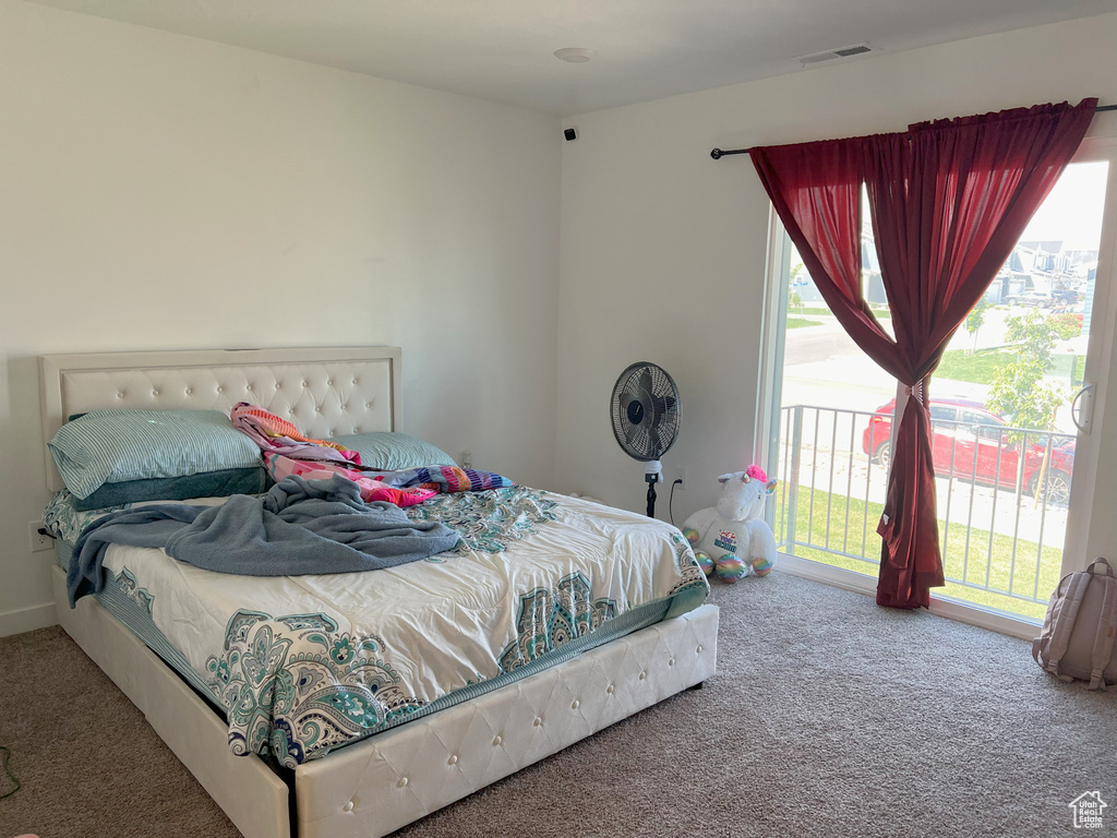Bedroom featuring carpet and access to outside