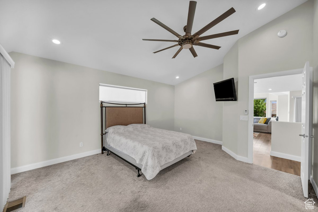 Bedroom with carpet floors, baseboards, recessed lighting, high vaulted ceiling, and a ceiling fan