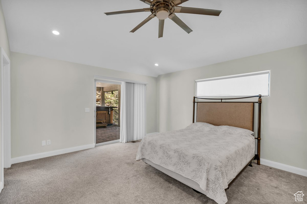 Bedroom with carpet, baseboards, recessed lighting, and access to exterior