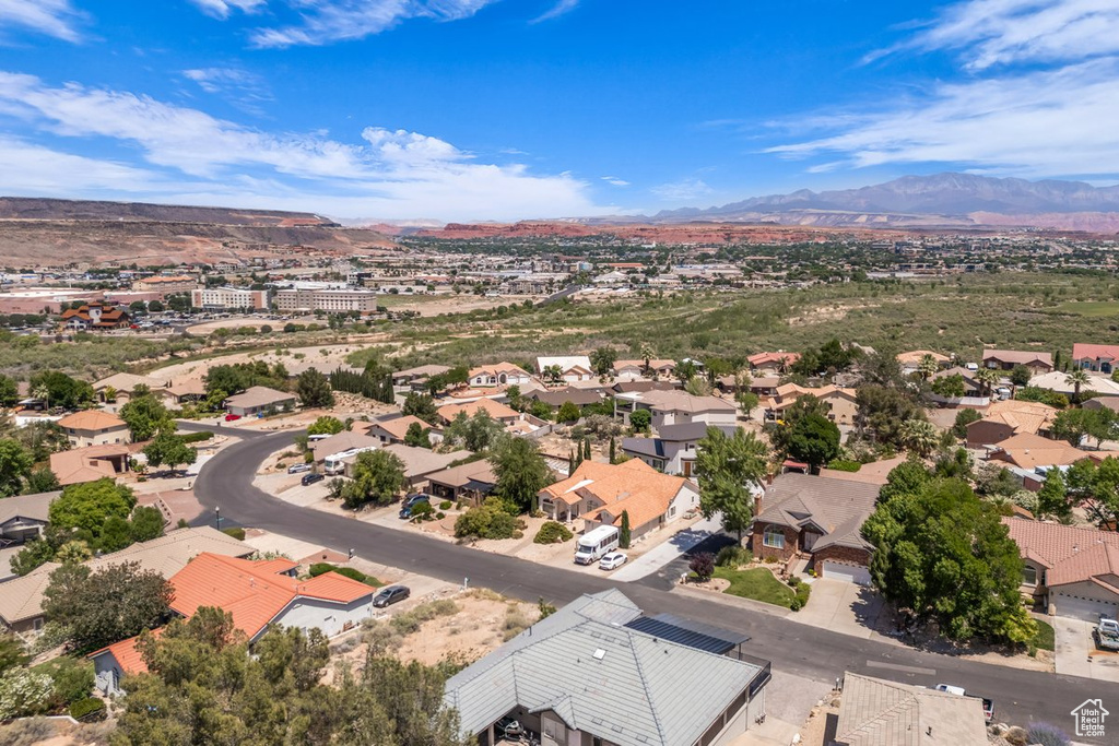 Aerial view of residential area featuring a mountain backdrop