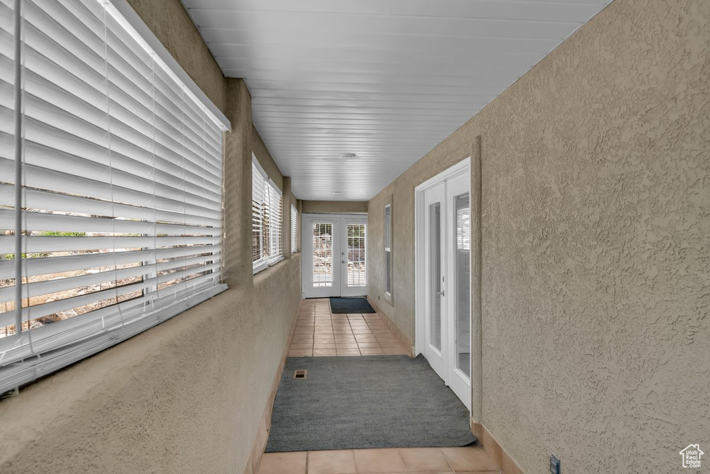 Hallway featuring french doors