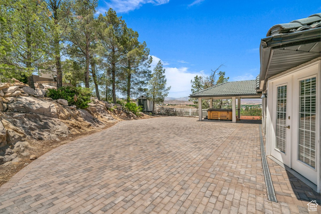 View of patio / terrace featuring a hot tub