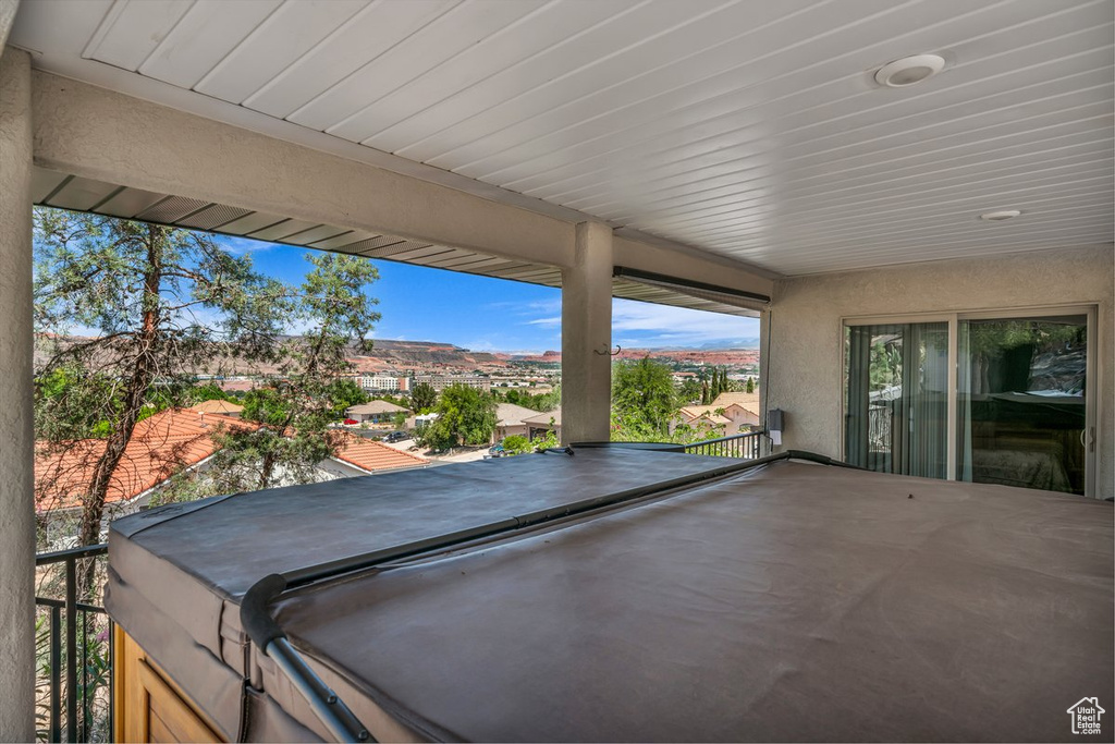 View of patio featuring a hot tub