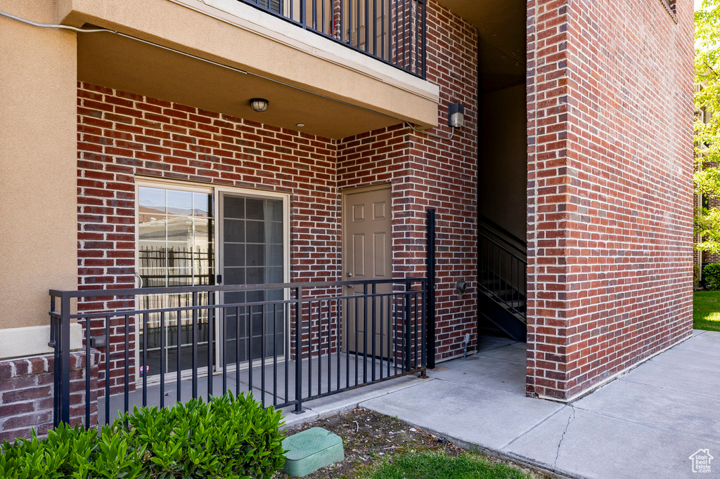 Entrance to property with brick siding