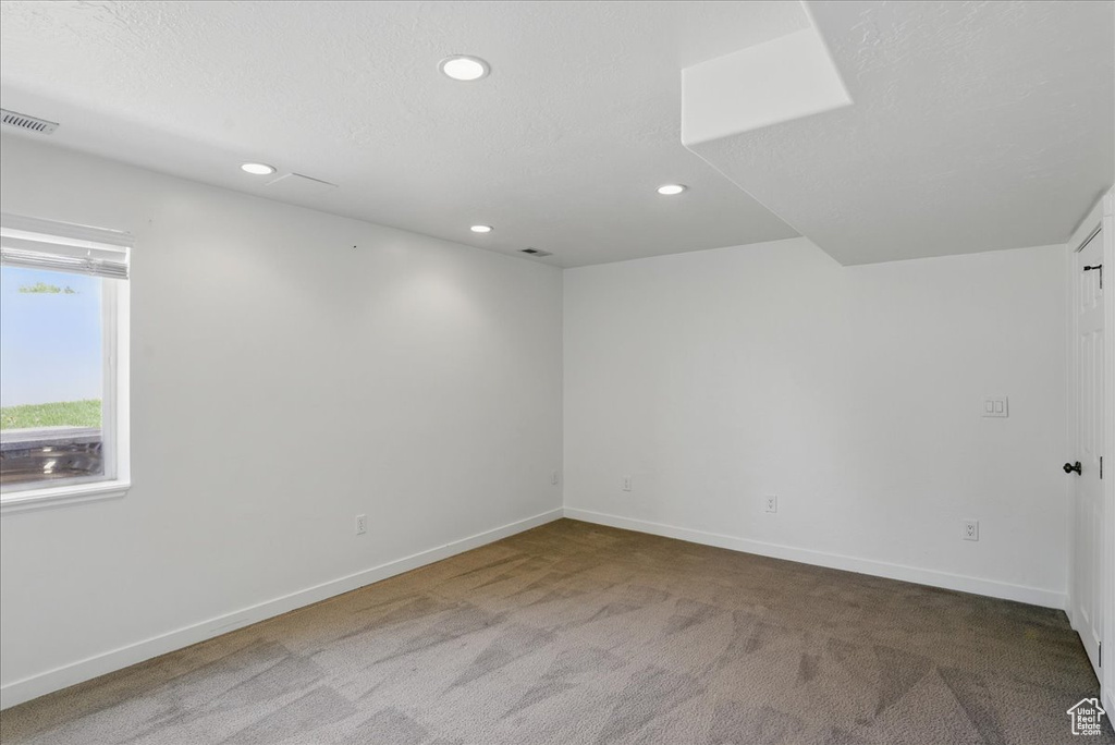 Unfurnished room with carpet floors, recessed lighting, and baseboards