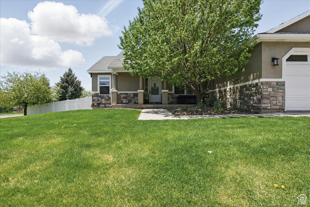 View of front facade with stone siding and stucco siding