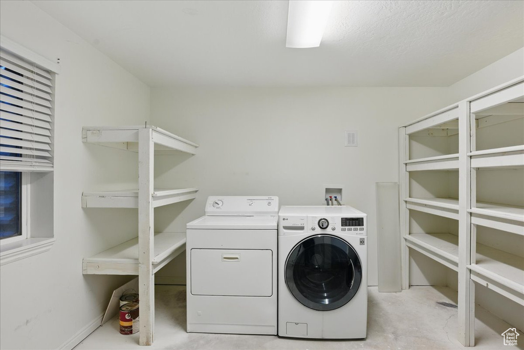 Washroom featuring separate washer and dryer
