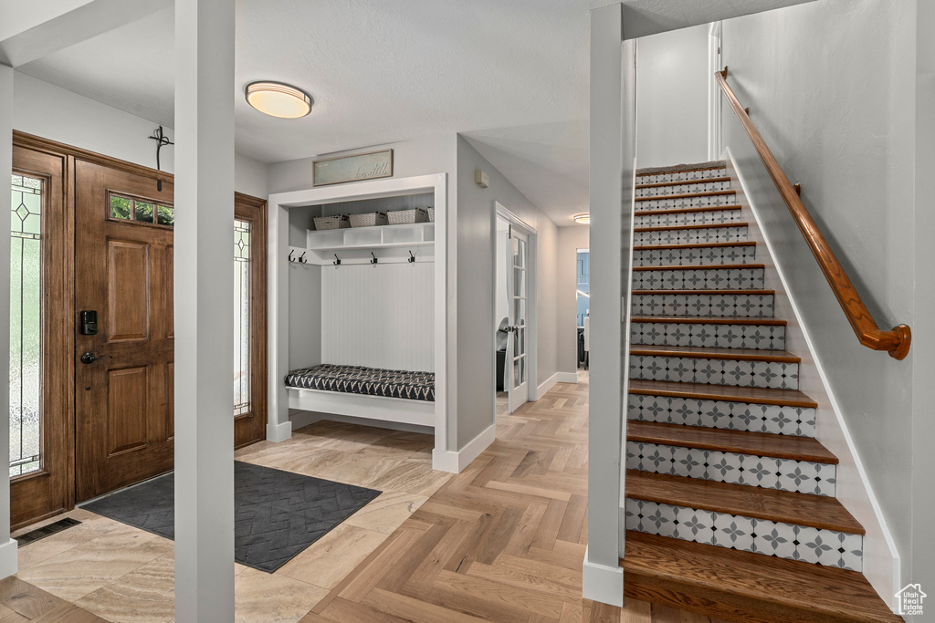 Mudroom featuring baseboards