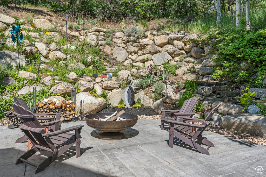 View of patio / terrace with a fire pit