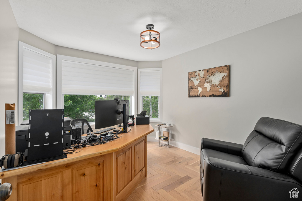 Office area featuring baseboards