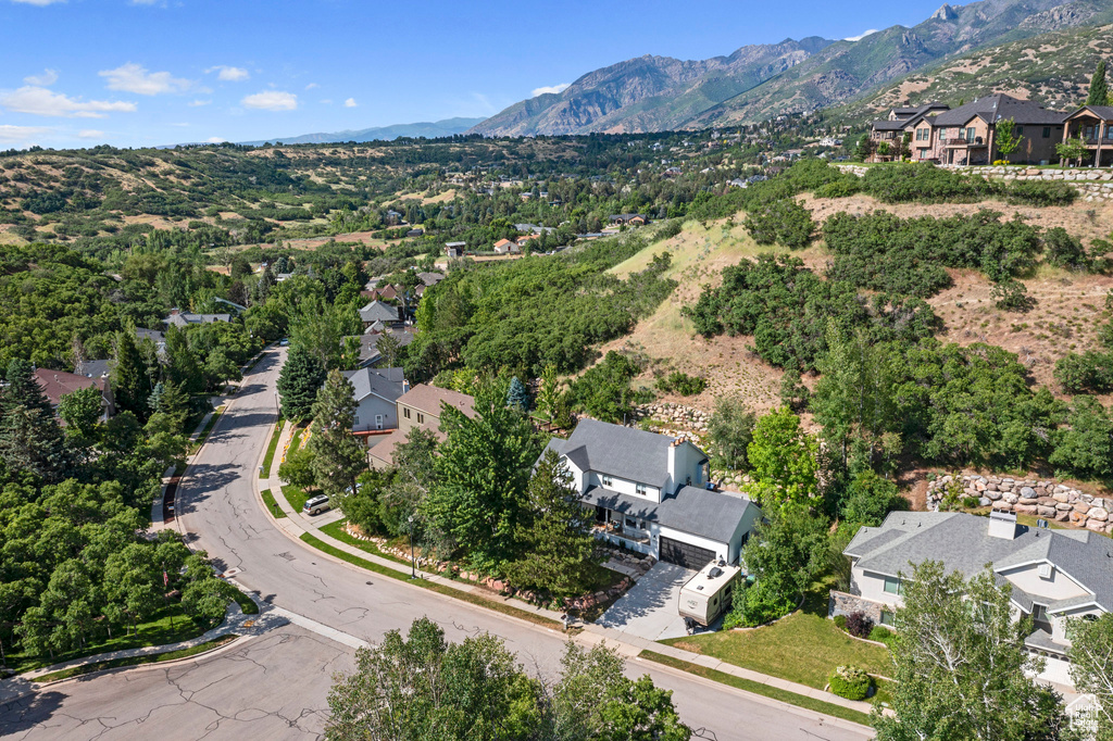 View of property location featuring nearby suburban area and a mountainous background