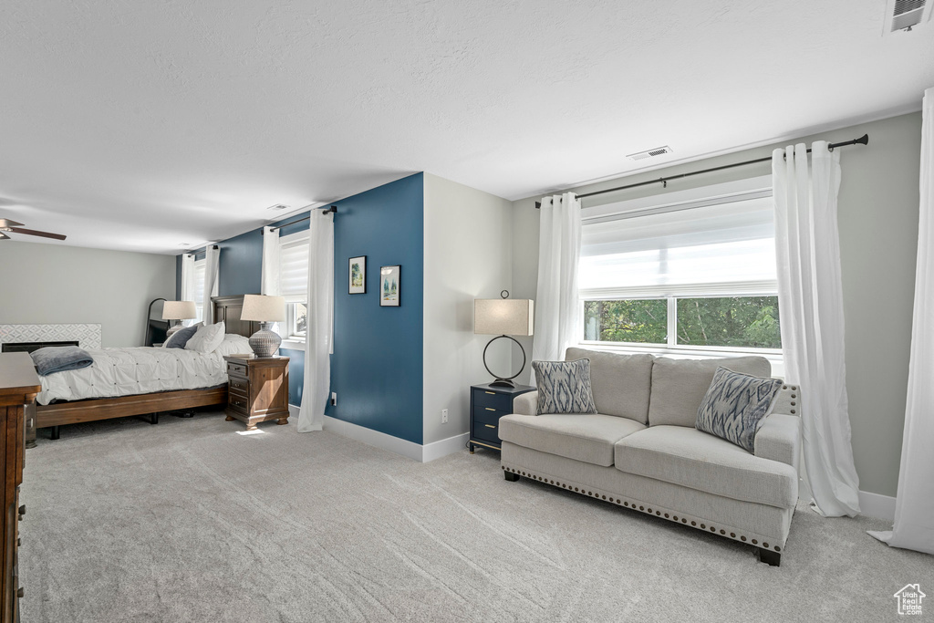 Bedroom with carpet flooring and baseboards