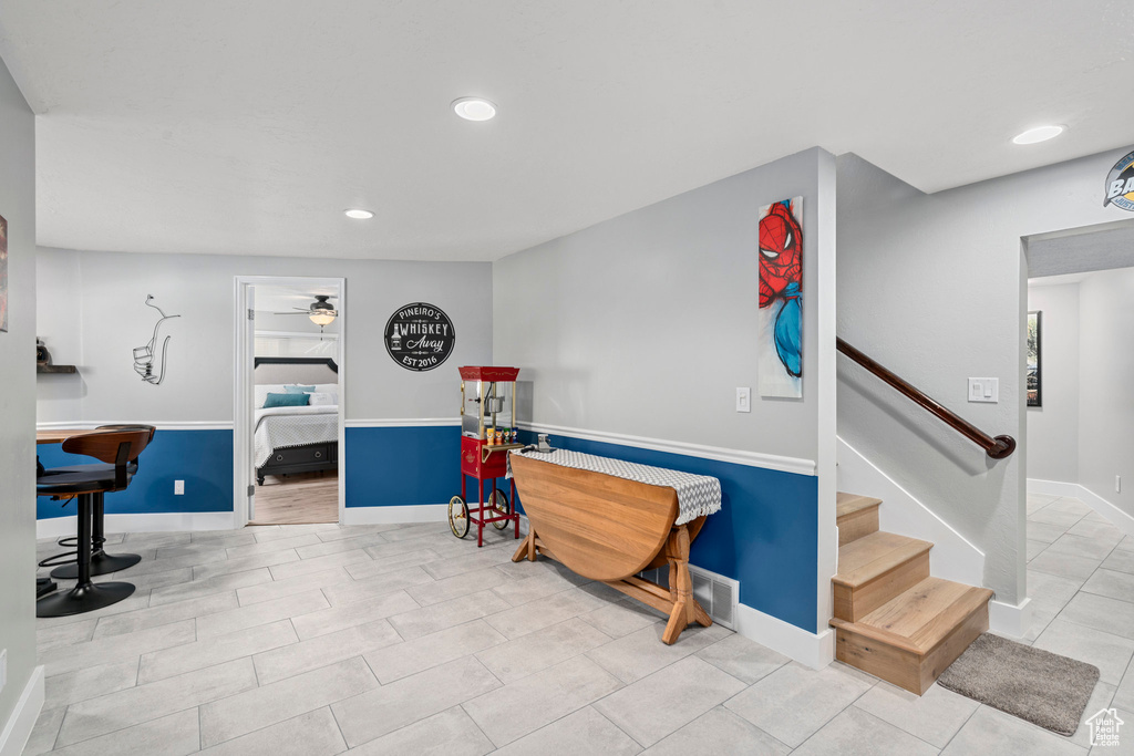 Interior space featuring a ceiling fan, recessed lighting, and baseboards