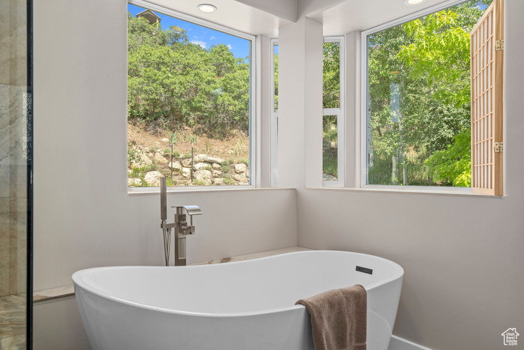 Full bathroom with a freestanding bath