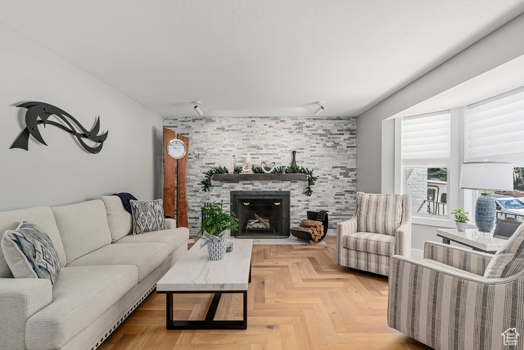Living area featuring a stone fireplace
