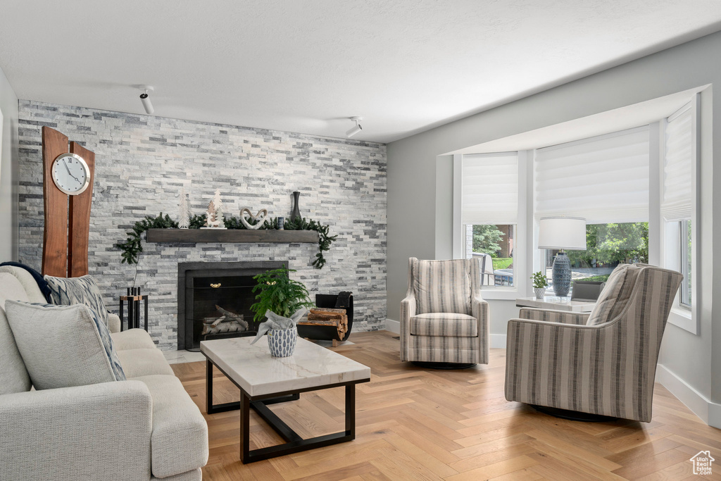 Living area featuring a fireplace and baseboards