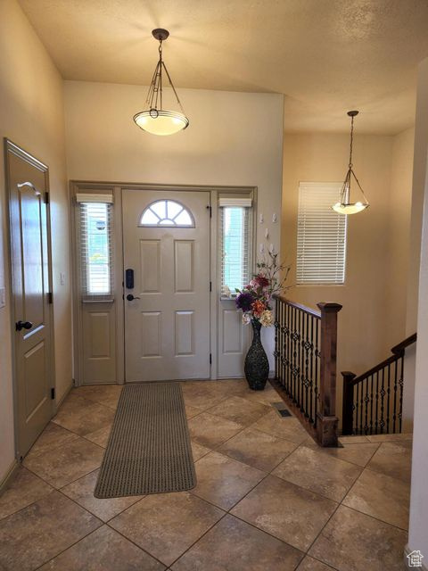 Entryway featuring tile patterned flooring