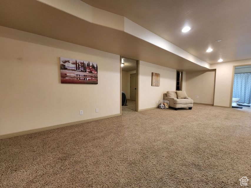Finished below grade area featuring carpet floors, recessed lighting, and baseboards