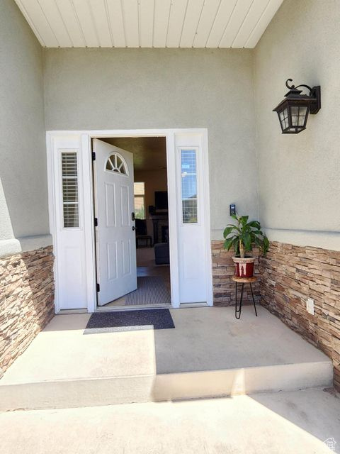 Doorway to property with stucco siding