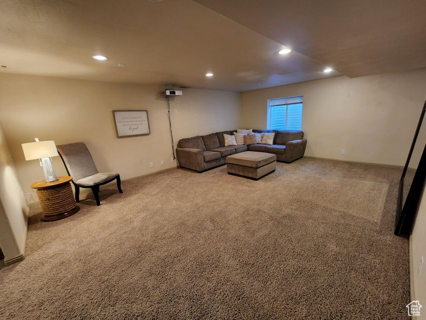 Living room featuring carpet flooring and recessed lighting