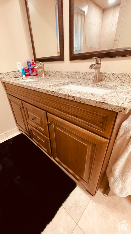 Bathroom featuring vanity and tile patterned flooring
