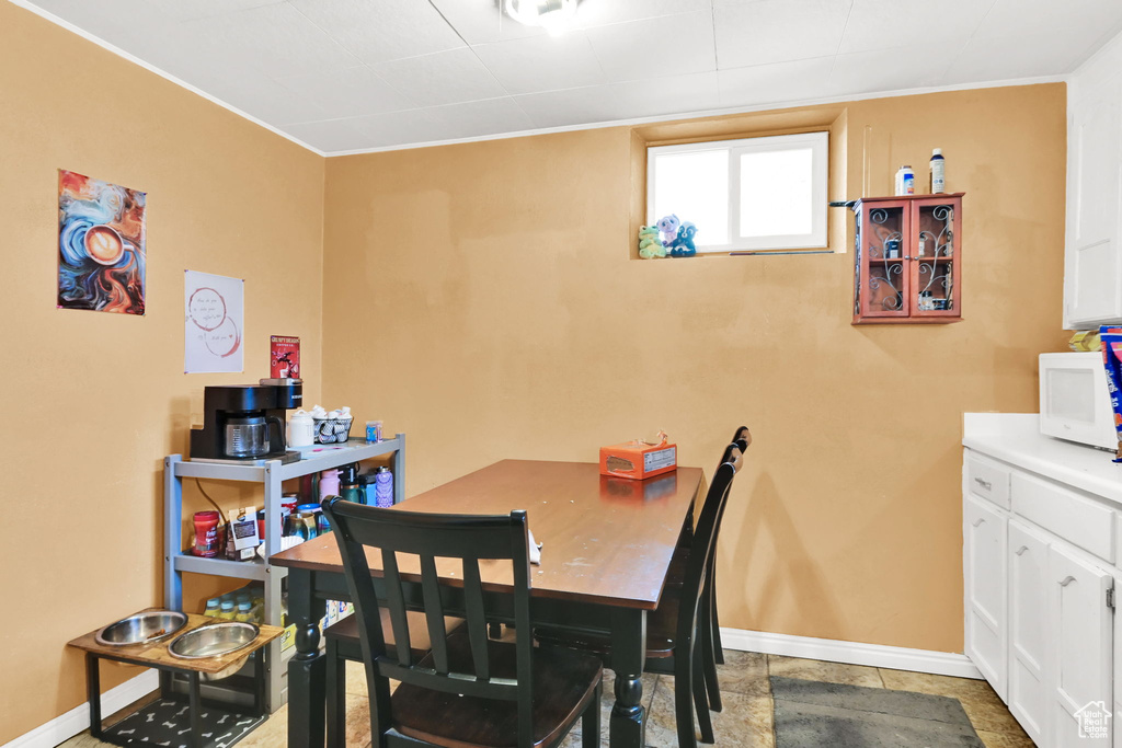 Dining space featuring baseboards and ornamental molding