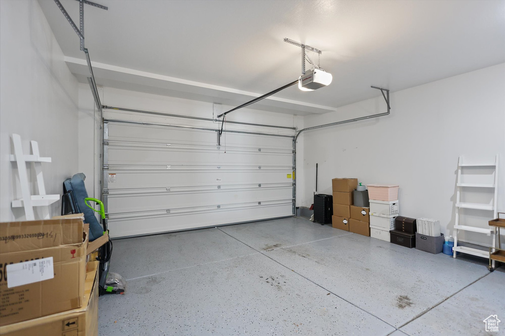 Garage featuring a garage door opener
