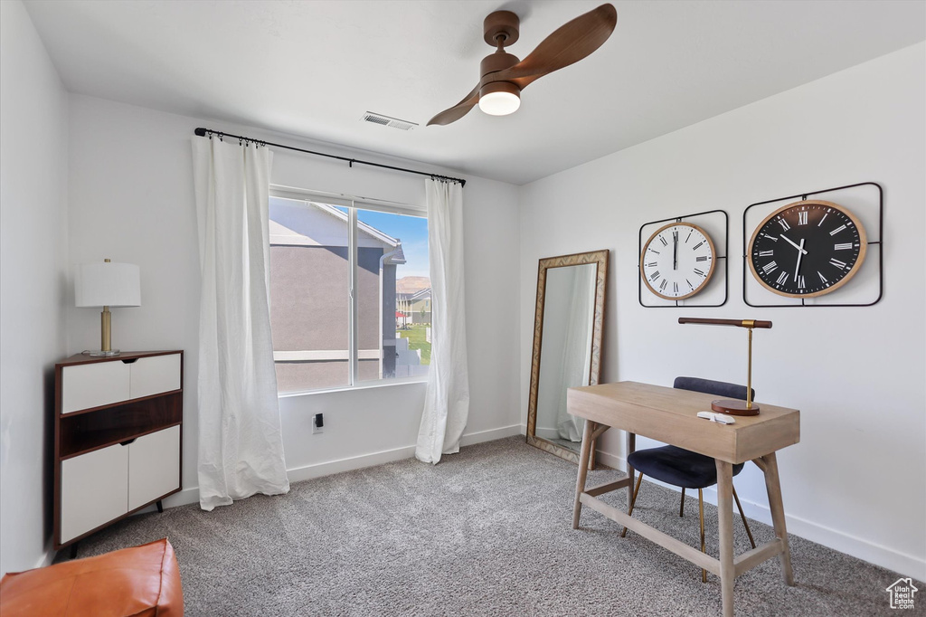 Office space with carpet, baseboards, and ceiling fan