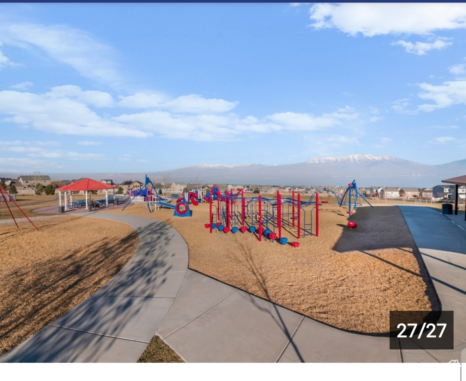 Community play area with a gazebo and a mountain view