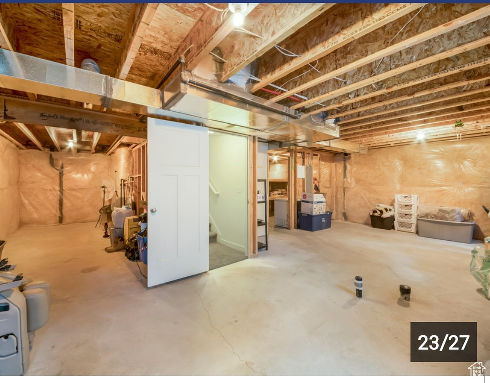 Unfinished basement featuring stairs