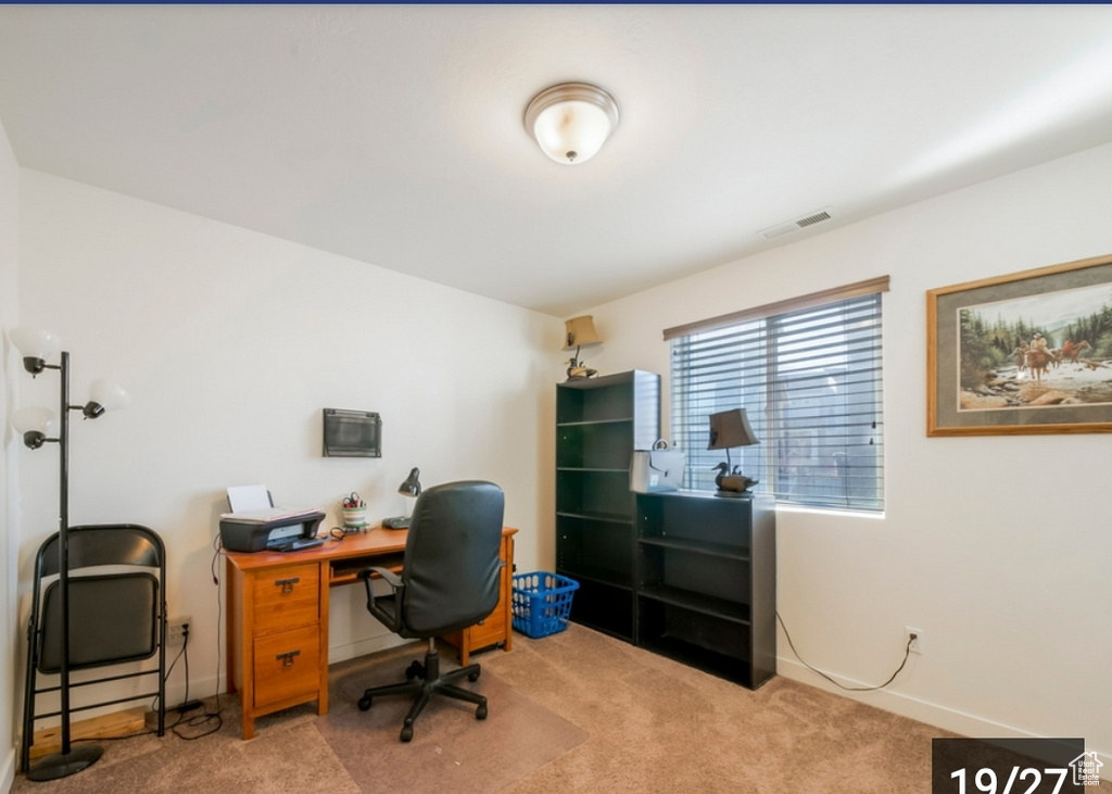 Office area featuring carpet flooring and baseboards