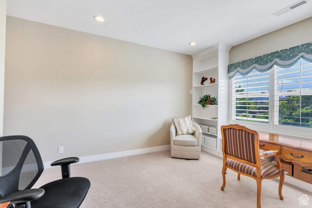 Office area featuring light colored carpet, baseboards, and recessed lighting