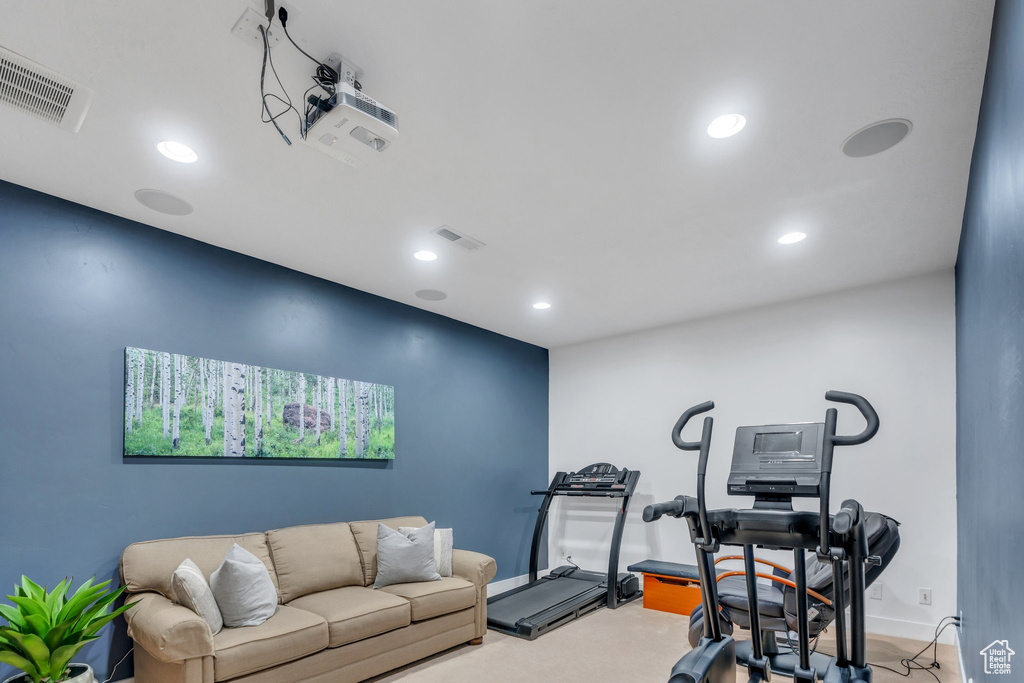 Workout room with recessed lighting and baseboards