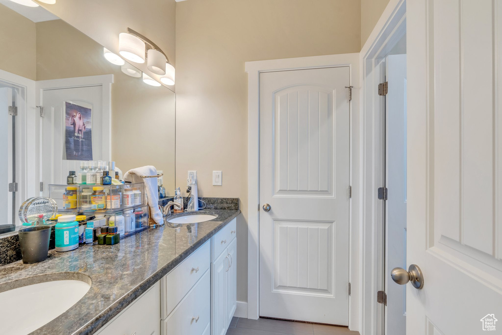 Full bathroom featuring double vanity