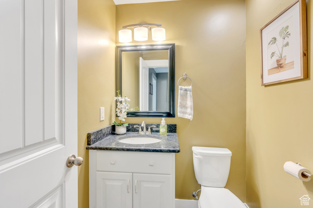 Half bath with toilet and vanity