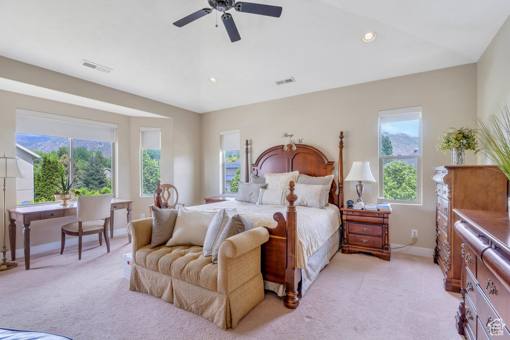 Bedroom featuring multiple windows, light colored carpet, baseboards, and recessed lighting