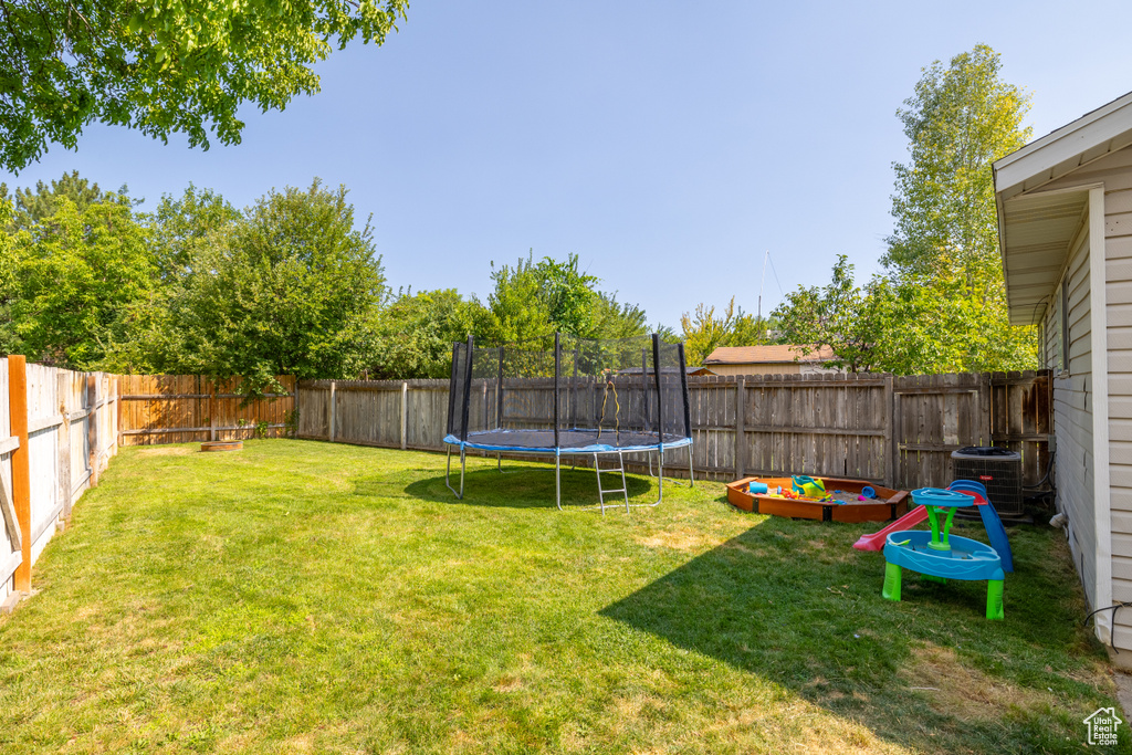View of yard with a trampoline