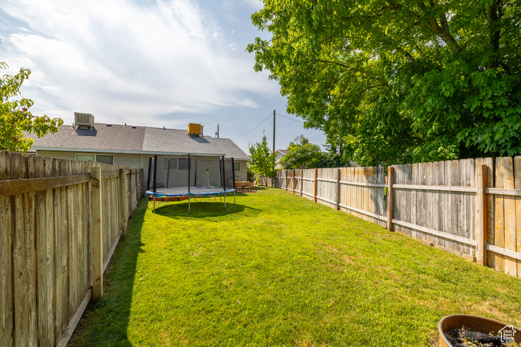 View of yard with a trampoline