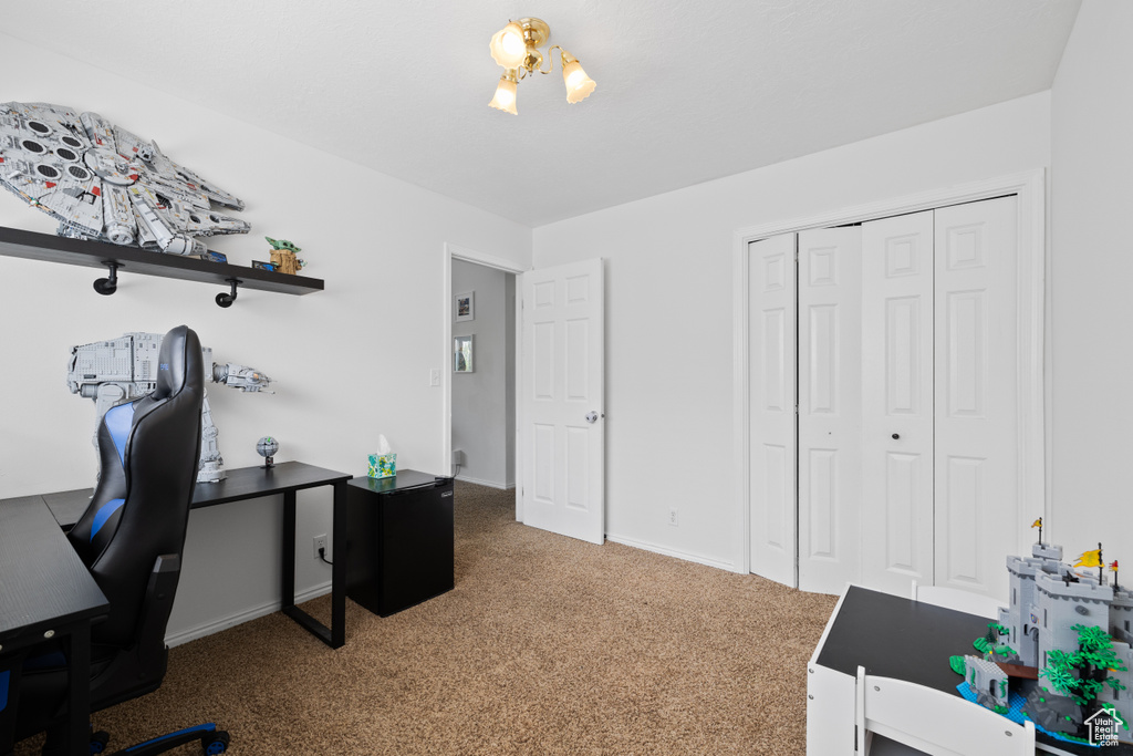 Office space featuring carpet and baseboards