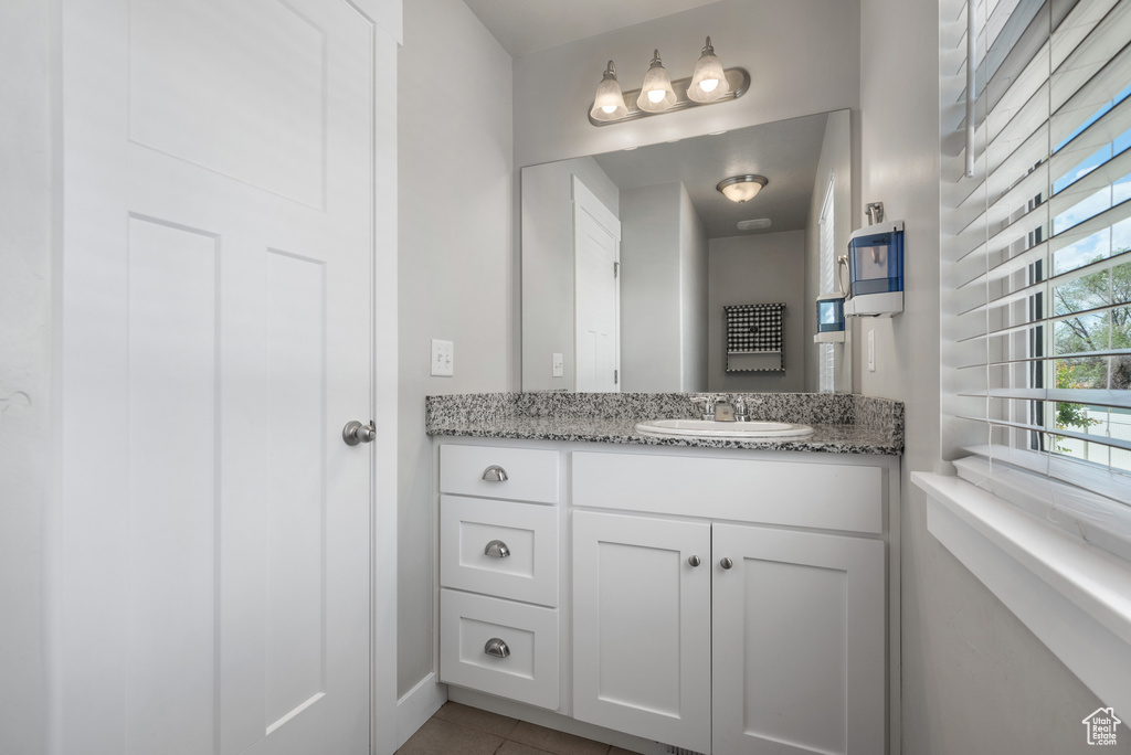 Bathroom with vanity and tile patterned flooring