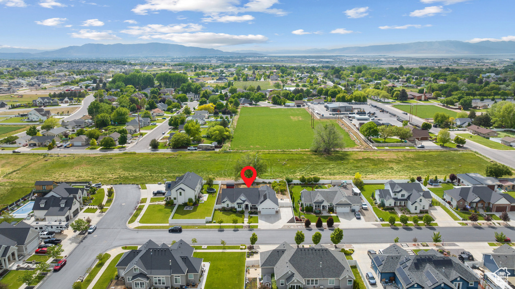 Aerial perspective of suburban area with a mountain backdrop