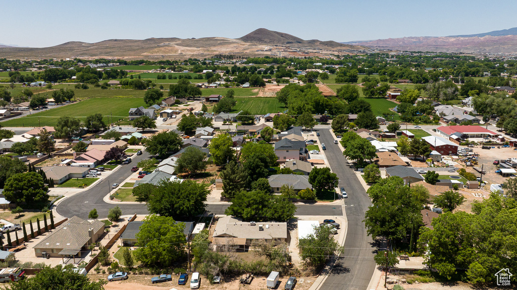 Aerial view of residential area featuring a mountain backdrop