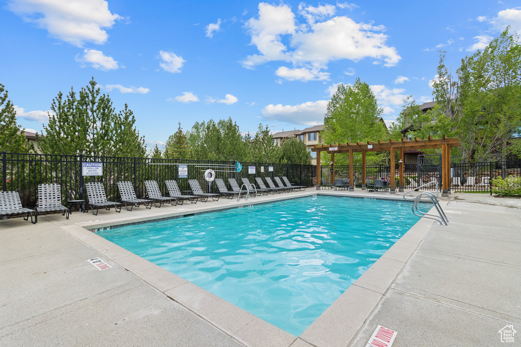 Community pool featuring a patio area