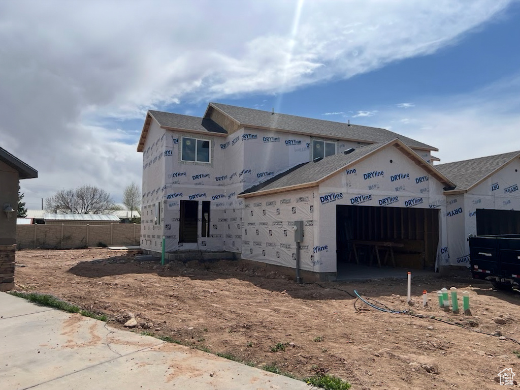 View of front of property featuring an attached garage