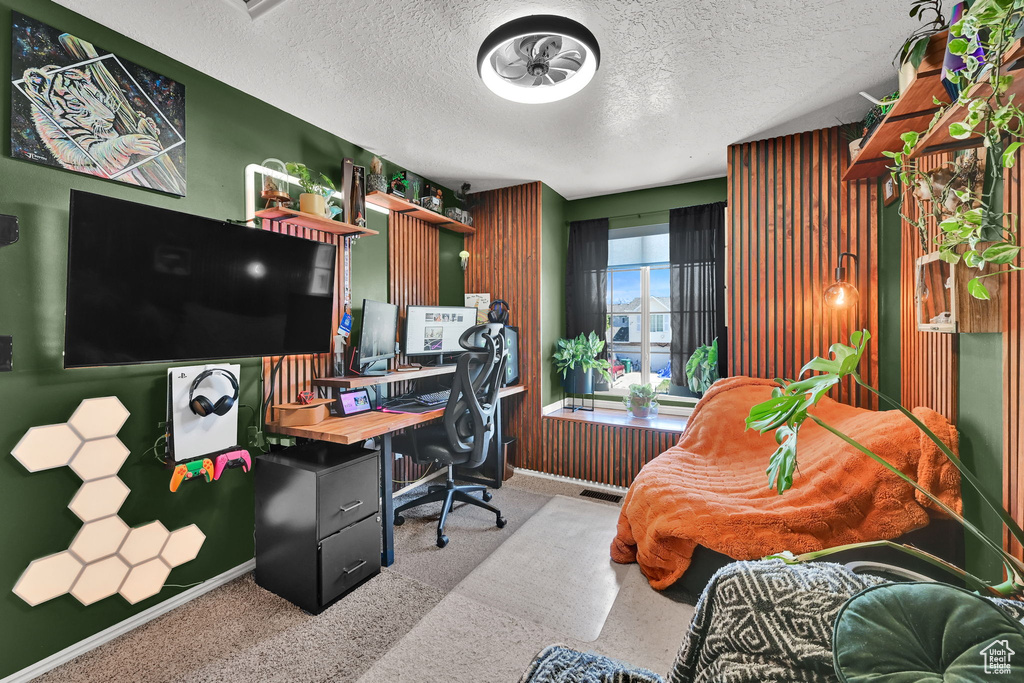 Office featuring a textured ceiling and baseboards