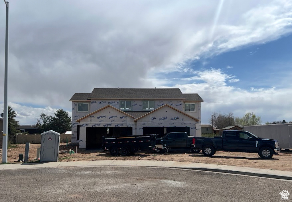 Property in mid-construction featuring an attached garage