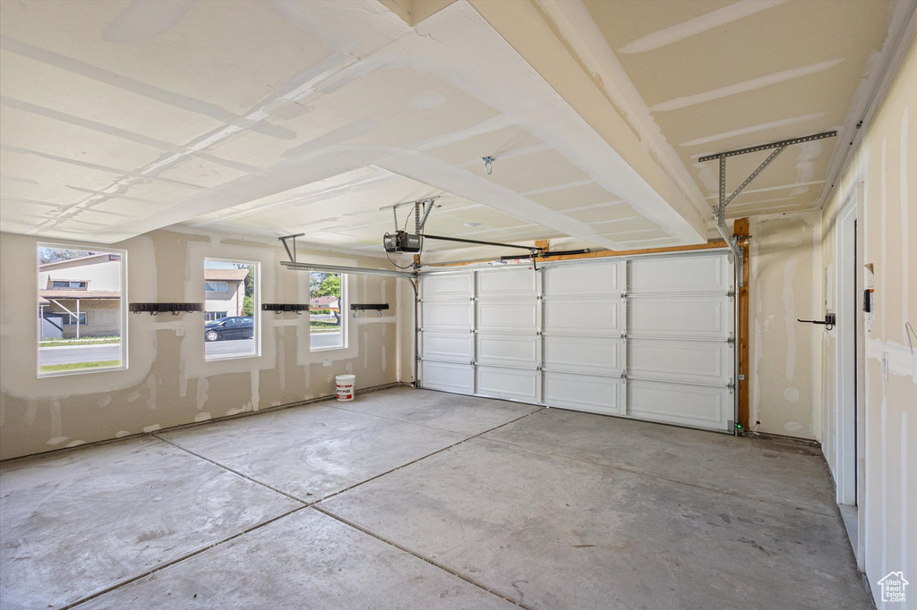 Garage featuring a garage door opener