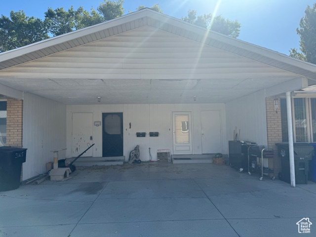 Garage featuring a carport