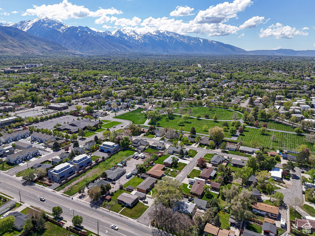 Aerial perspective of suburban area featuring a mountain backdrop