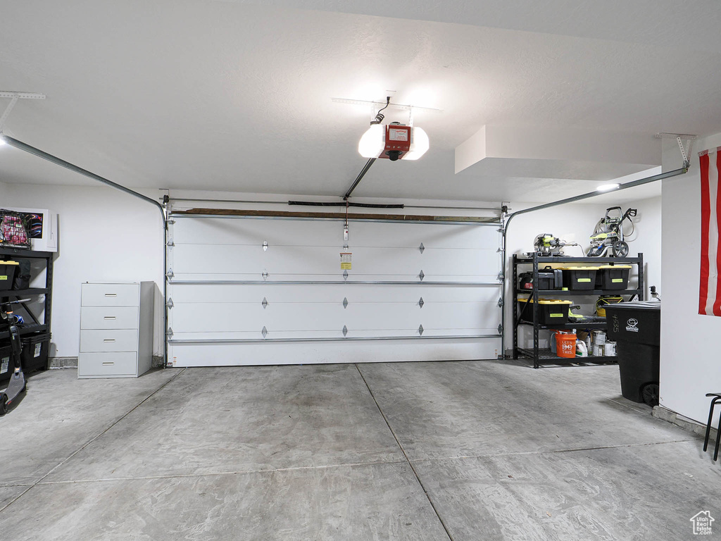 Garage featuring a garage door opener